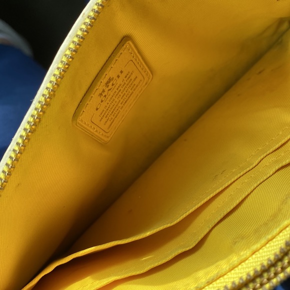 Yellow wristlet wallet, coach and leather, a good amount of space in the pockets - Picture 4 of 5